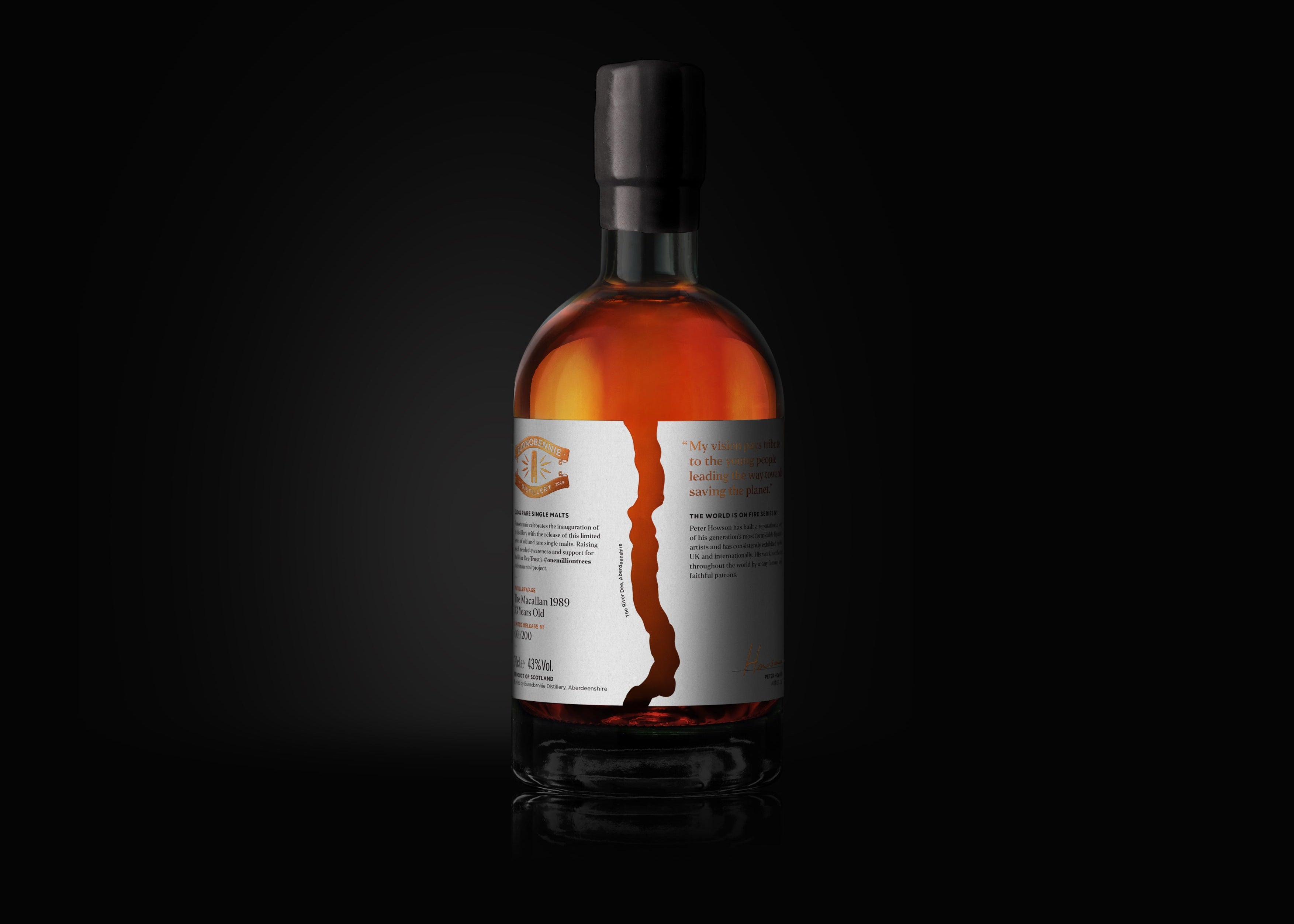 Bottle of whiskey with a label on a black background